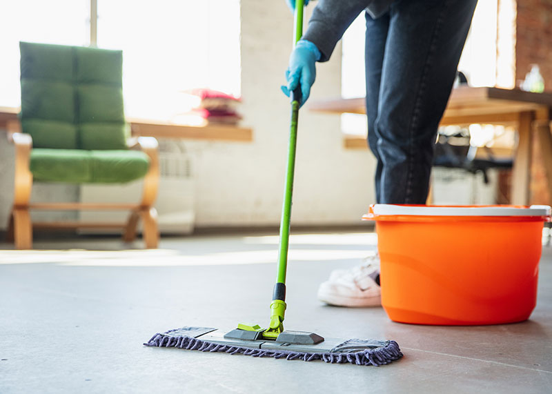 No Sub-Contract Work Mac's employee mopping floor in floor refinishing project