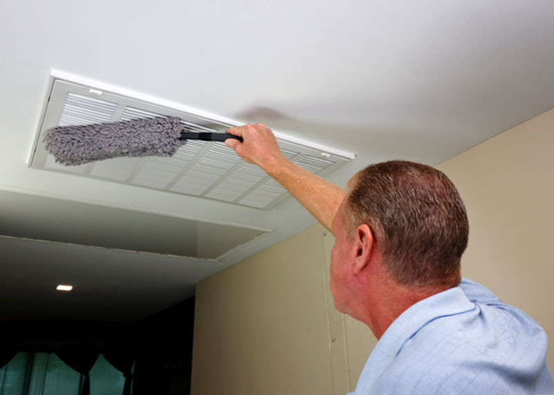 High Dusting deep cleaning project with janitor dusting vent on ceiling