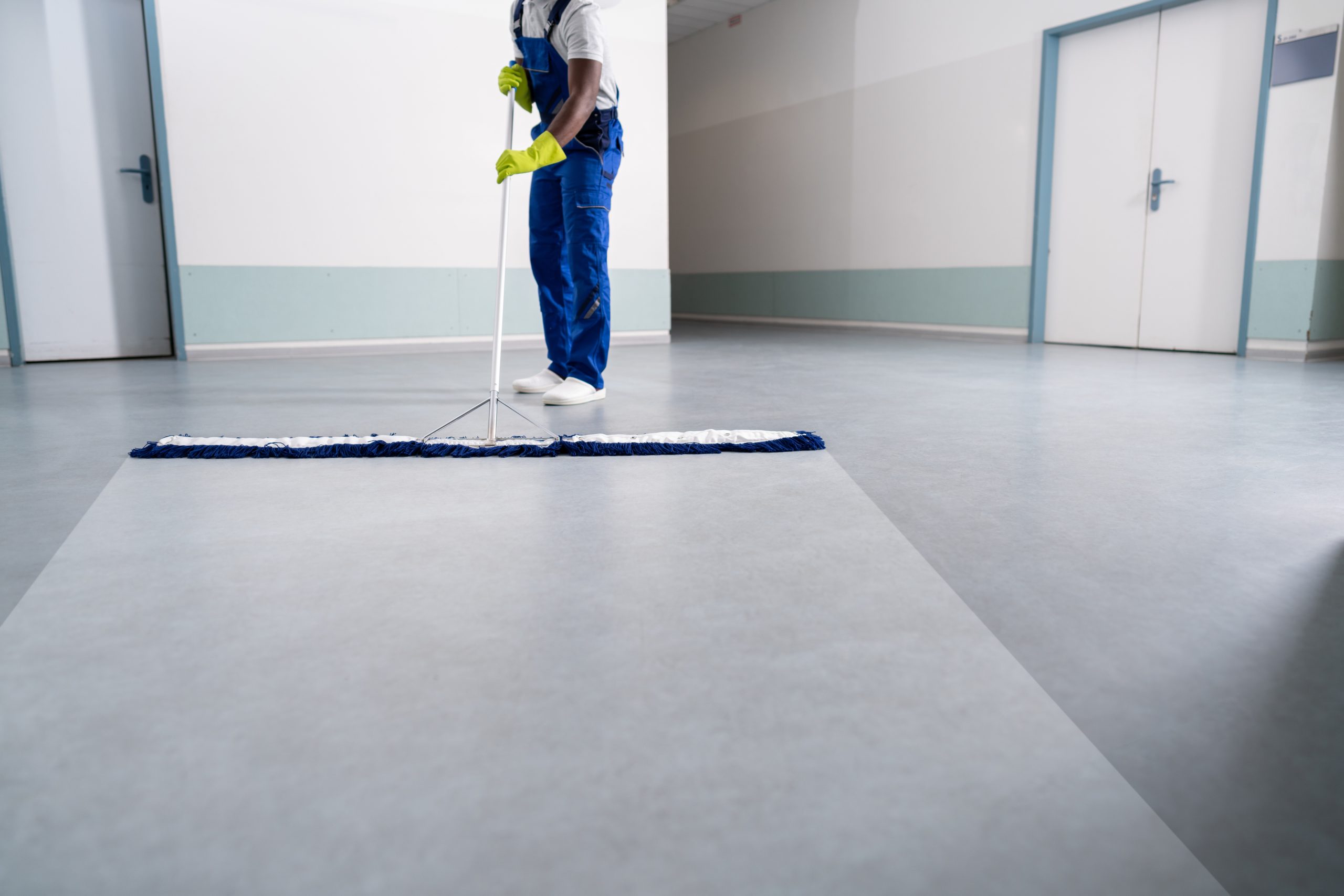 Large office facility building hallways being mopped