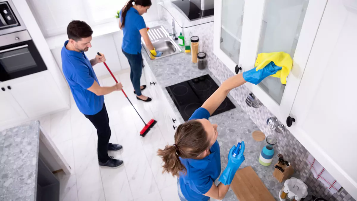 Janitors cleaning office space from overhead view