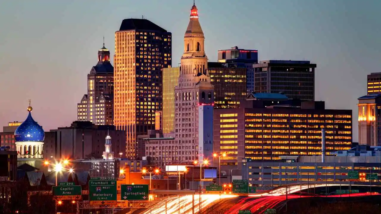Hartford, CT skyline at dusk with view from the highway