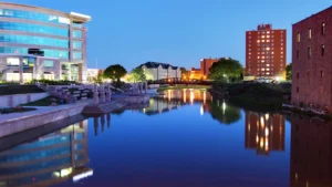 Sioux Falls, SD skyline of business district on waterfront at dusk