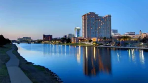 Wichita, KS skyline on the waterfront at dusk