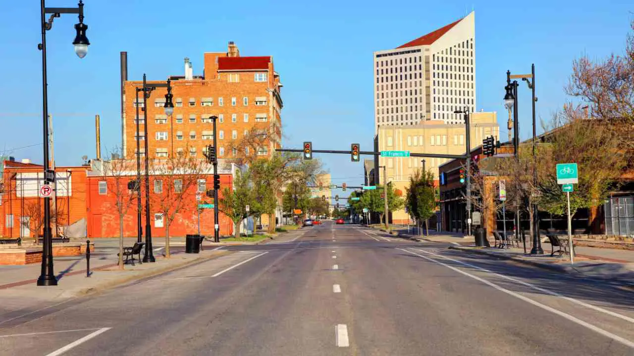 Wichita, KS in center of town during the day with roads and building on either side