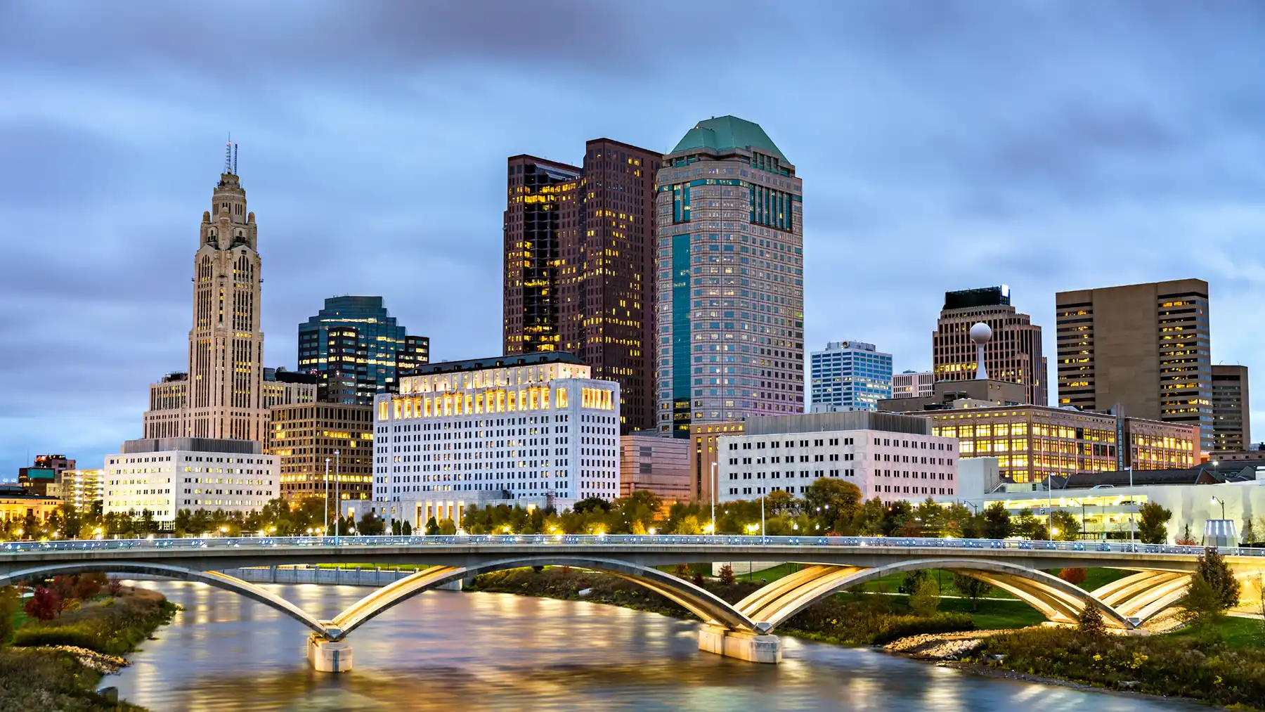 Columbus, OH business skyline with river front view during dusk