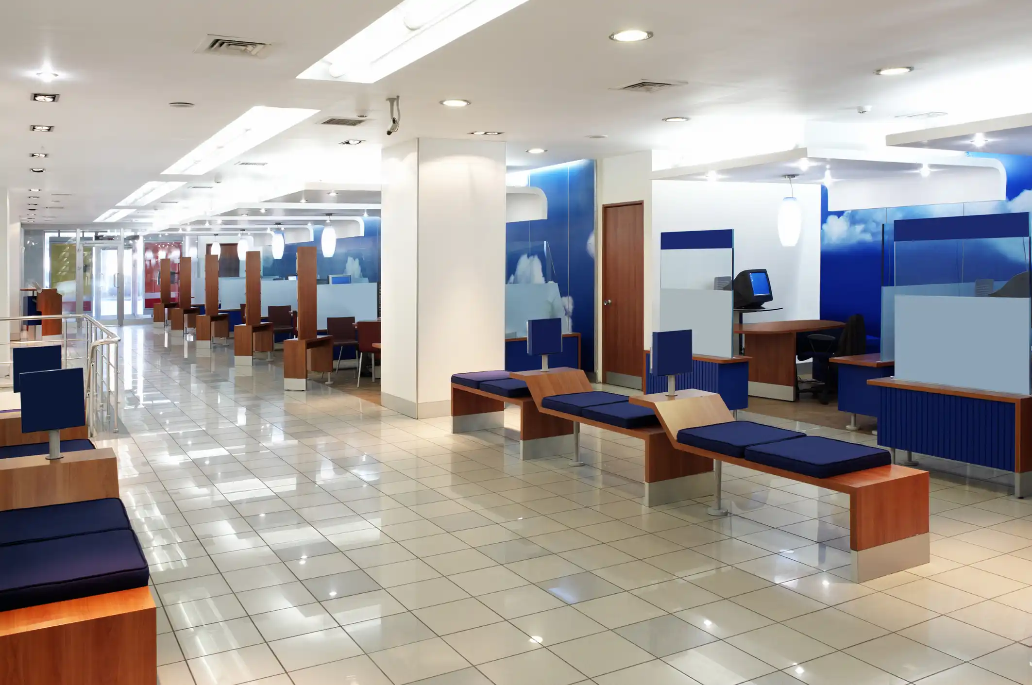 Financial institution and bank waiting area with long hallway and benches