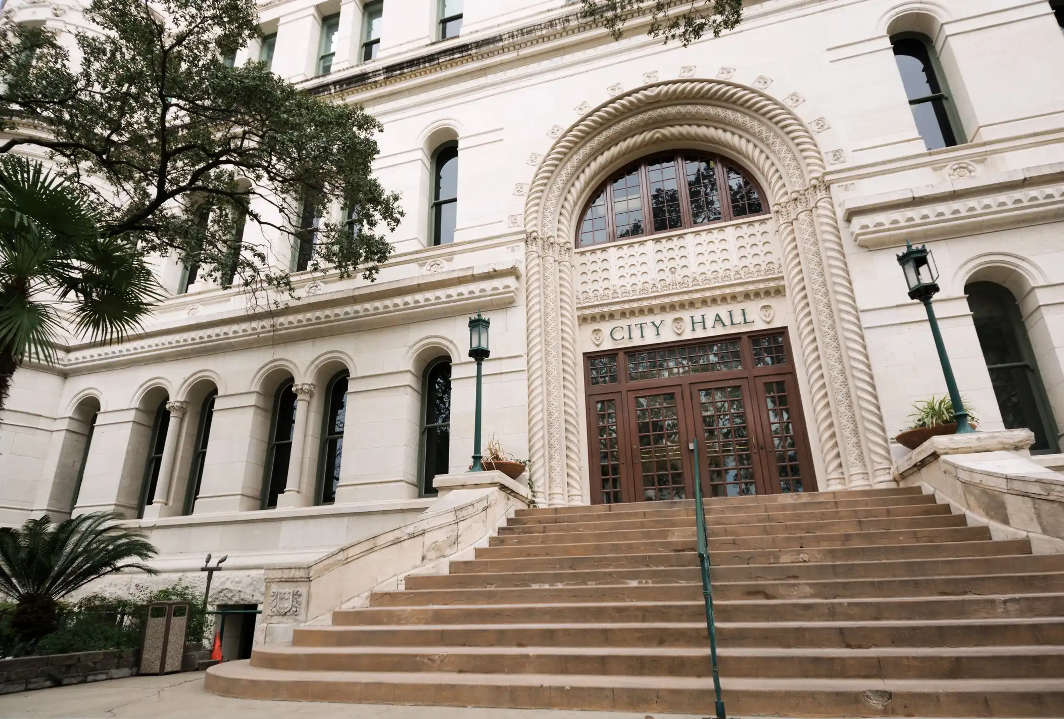 City Hall white building with steps and columns.