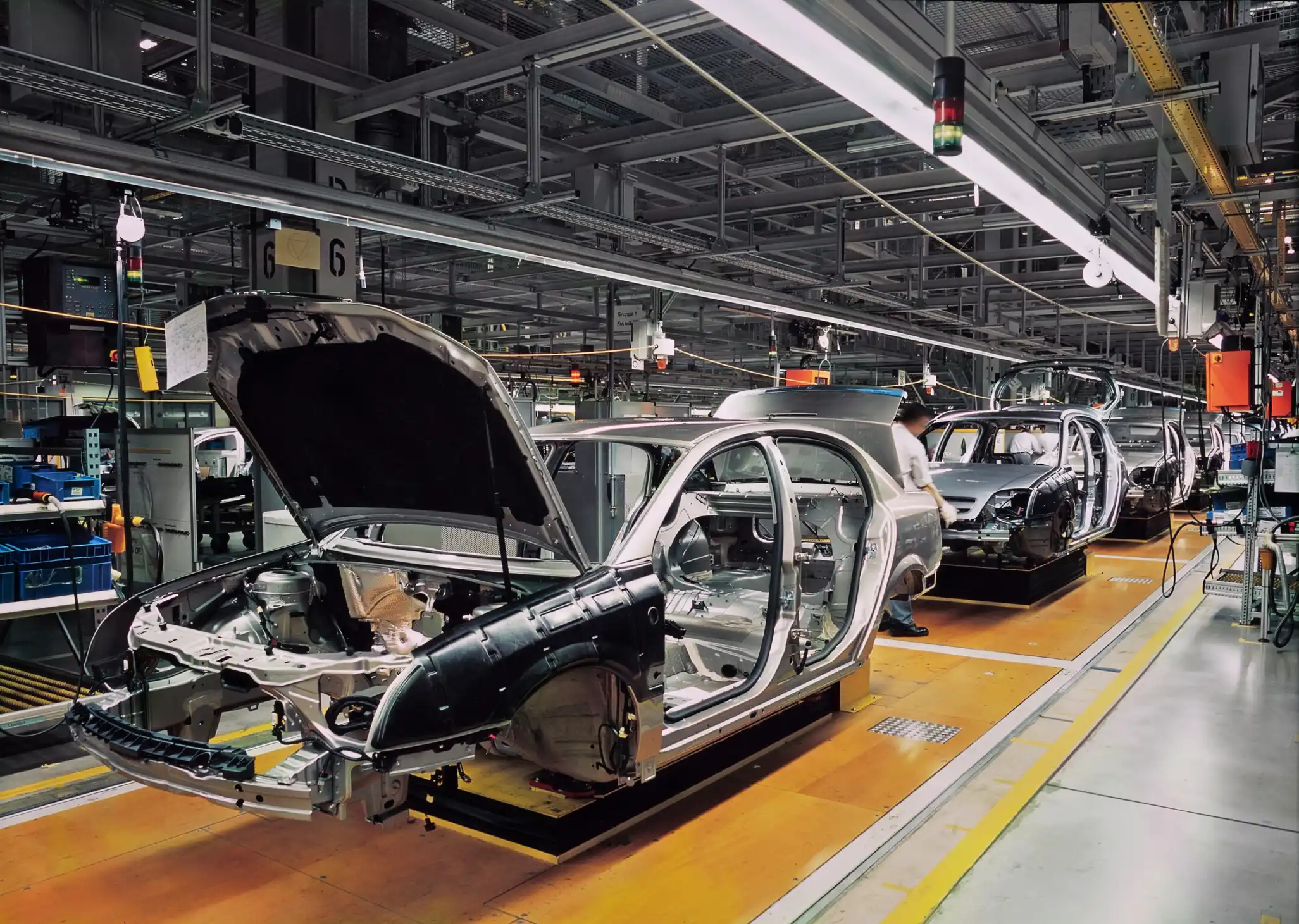 Clean and tidy automative assembly line with car metal frames lined up