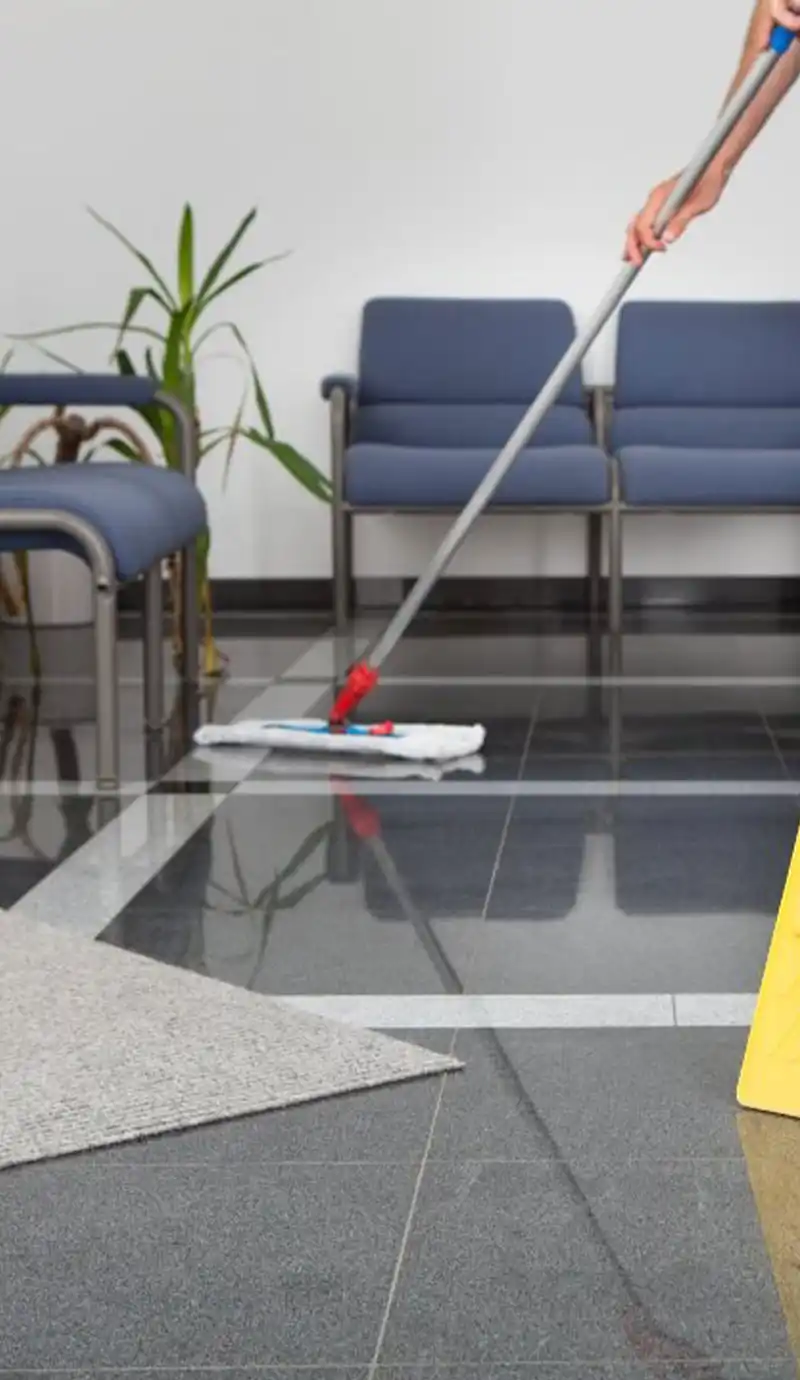 Mop dusting floor in reception waiting area