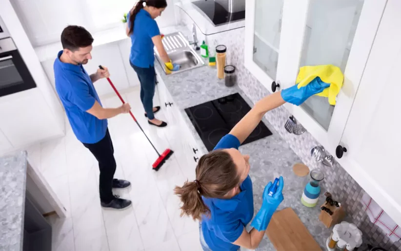 Janitors cleaning office space from overhead view
